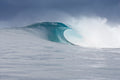 A clear blue wave about to break