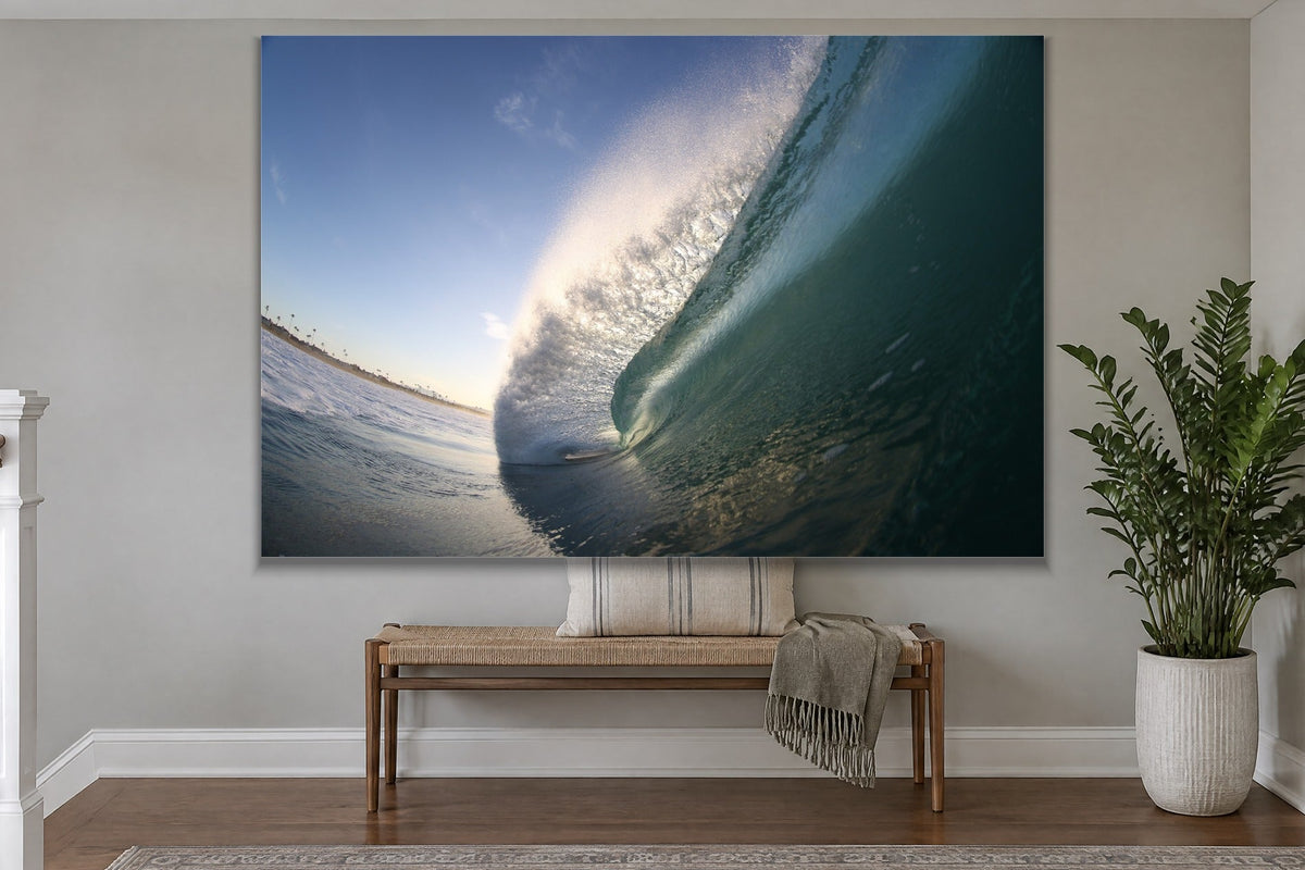 A steep blue wave face lit from behind with a curved horizon line shown large on the wall of a lived-in room