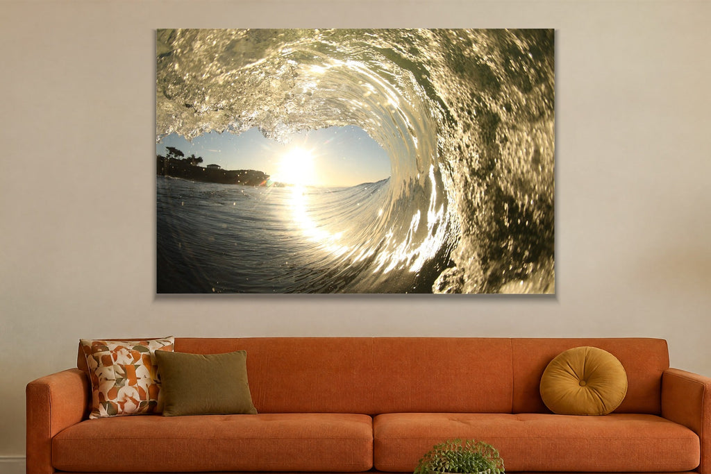 A wave tube with warm golden light shining through textured water shown large on the wall of a lived-in room