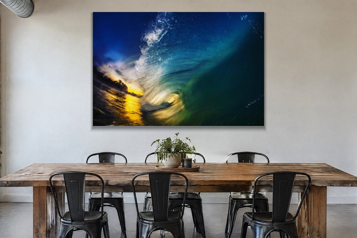 Inside a dark blue wave with golden sunset light at the opening shown large on the wall of a lived-in room
