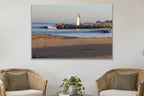 Lighthouse Morning metal print hanging above furniture in a living space