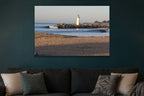 Lighthouse Morning metal print hanging above furniture in a living space
