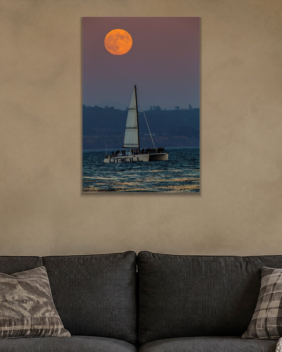 Moon and the Boat metal print hanging above furniture in a living space