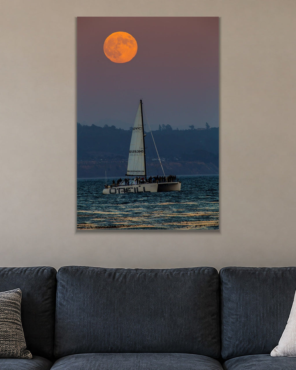 Moon and the Boat metal print hanging above furniture in a living space