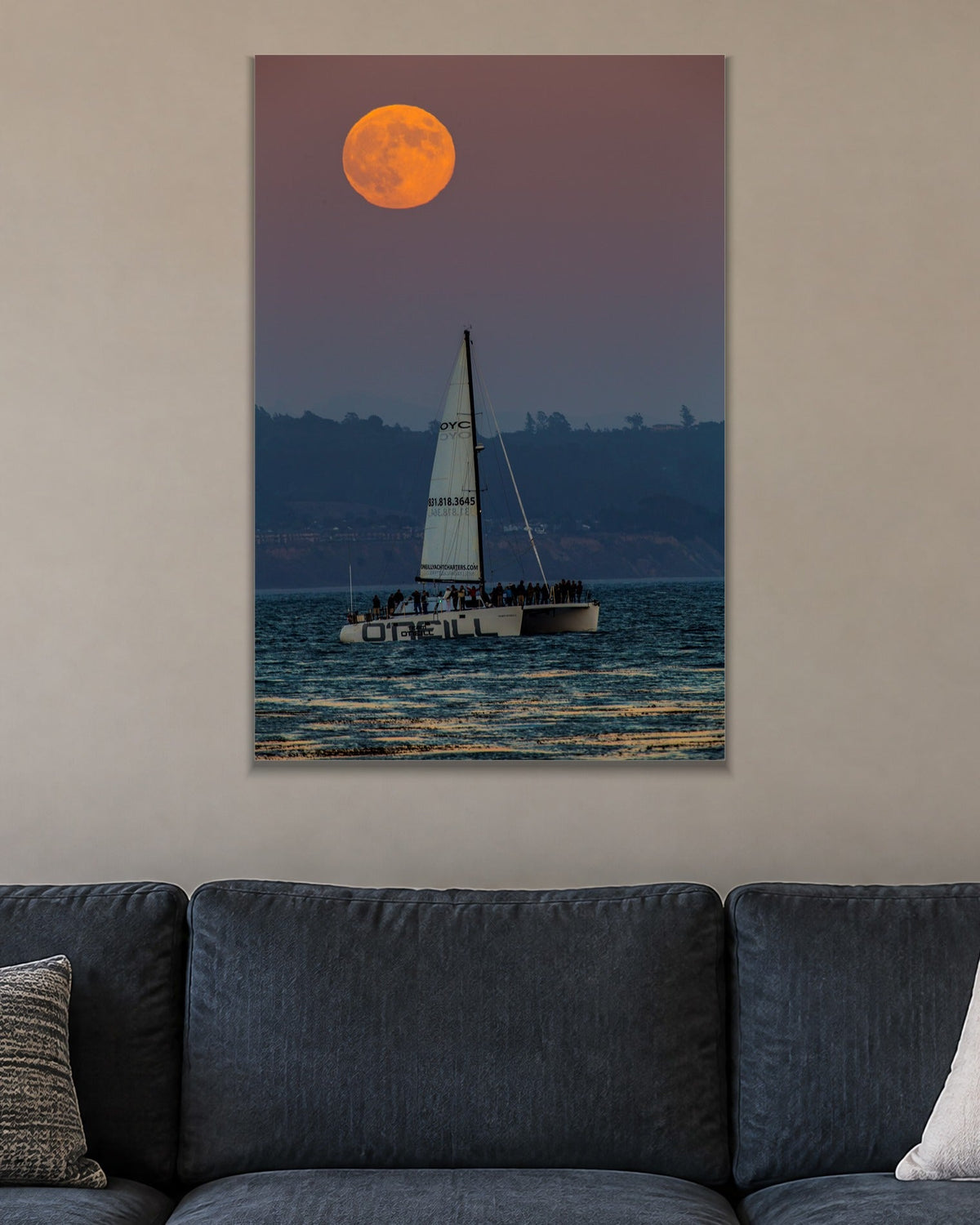 Moon and the Boat metal print hanging above furniture in a living space