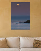 Moonrise metal print hanging above furniture in a living space