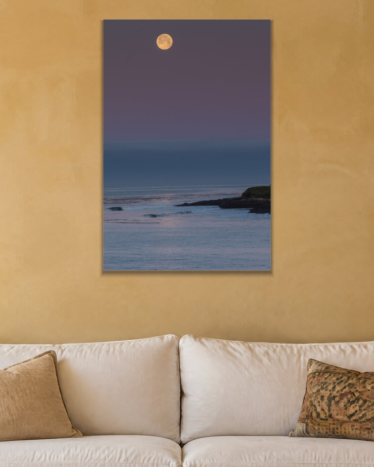 Moonrise metal print hanging above furniture in a living space