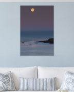 Moonrise metal print hanging above furniture in a living space
