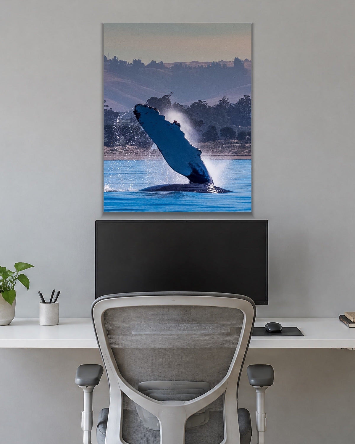 The Whale Wave metal print hanging above furniture in a living space
