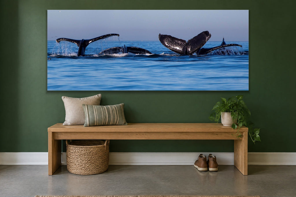 Whale Family metal print hanging above furniture in a living space