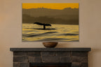 Whale Tail metal print hanging above furniture in a living space