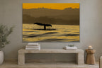 Whale Tail metal print hanging above furniture in a living space